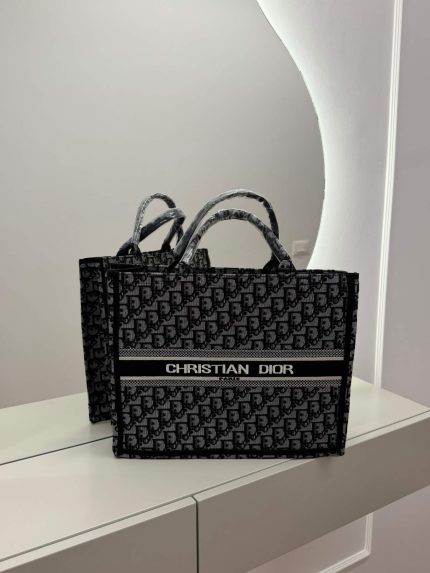 Dior Book Tote Oblique, luxury university bag on display.