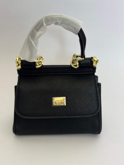 Dolce & Gabbana Sicily Mini black handbag with gold accents.