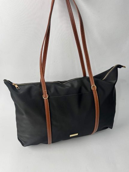 Black nylon tote bag with brown leather straps.