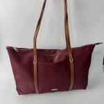 Burgundy nylon tote bag with leather straps.