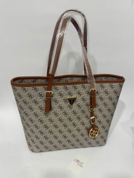 Guess monogram tote bag with brown leather straps.
