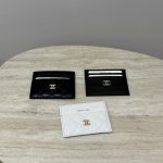 Chanel unisex card holders on marble table, black and white.