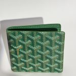 Green Goyard men's wallet with signature pattern design.