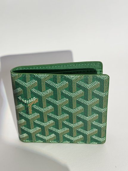 Green Goyard men's wallet with signature pattern design.