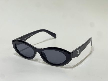 Prada women's sunglasses, black oval frames, luxury eyewear.