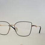 Skelete Optike Daisy Store stylish square eyeglasses with gold accents.