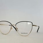 Elegant gold-rimmed glasses by Skelete Optike Daisy Store.