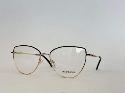 Elegant gold-rimmed glasses by Skelete Optike Daisy Store.