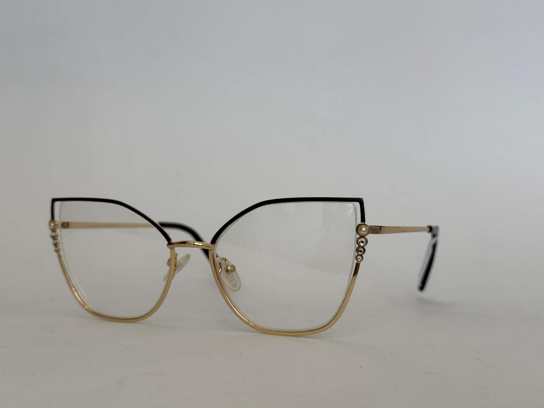 ds-syze-optike-133-kryesore Skelete Optike Daisy glasses, stylish gold and black frame.