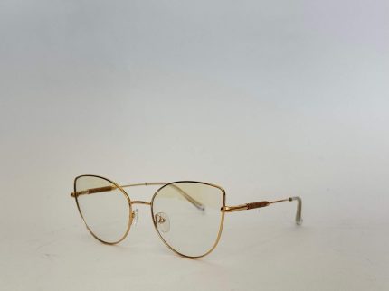 Skelete Optike Daisy Store stylish gold eyeglasses on white background.