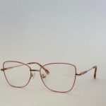 Skelete Optike Daisy Store stylish pink eyeglasses on white background.
