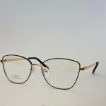 Stylish Skelete Optike Daisy eyeglasses with gold accents.