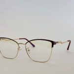 Skelete Optike Daisy glasses, stylish gold frame, cat-eye design.