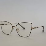 Skelete Optike Daisy Store stylish eyeglasses with gold frame.