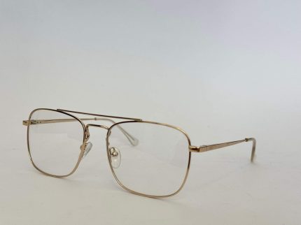 Elegant gold frame glasses by Skelete Optike Daisy Store.