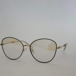 Skelete Optike Daisy Store stylish gold-rimmed eyeglasses.