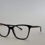 Women's stylish black eyeglasses with patterned temples.