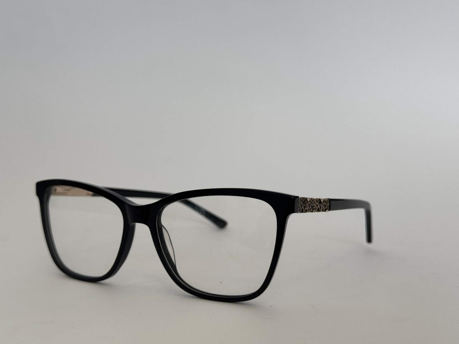 ds-syze-optike-186-kryesore Women's stylish black eyeglasses with patterned temples.