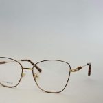 Elegant women's eyeglasses with gold frame, stylish and comfortable design.