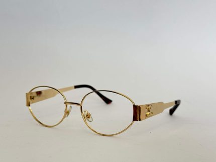 Gold women's optical glasses with round frames and sleek design.