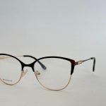 Elegant women's glasses with black and gold frame.