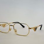 Gold Prada women's eyeglasses with geometric frame design.
