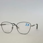 Skelete Optike Femra stylish metal eyeglasses with clear lenses.
