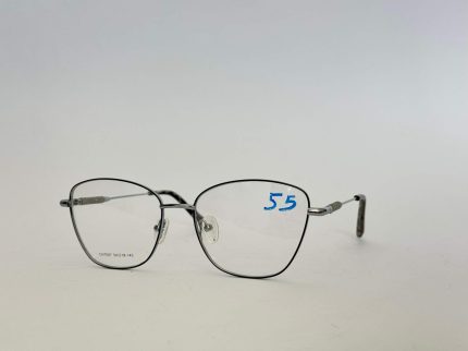 Skelete Optike Femra stylish metal eyeglasses with clear lenses.
