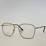 Skelete Optike Femra glasses, stylish black and gold frame.