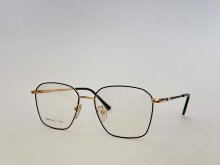Skelete Optike Femra glasses, stylish black and gold frame.