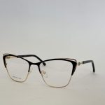 Elegant women's eyeglasses with black and gold frame.