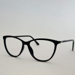 Stylish black women's eyeglasses frame on white background.