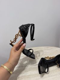 Black YSL Opyum sandals with gold heel and straps.