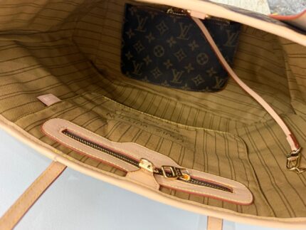 Interior of Louis Vuitton Neverfull bag with monogram pouch.