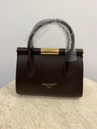 Dolce & Gabbana brown handbag with gold frame detail.