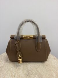 Dolce & Gabbana brown handbag with gold frame and lock.