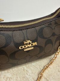 Coach Teri Shoulder Bag with chain and logo detail.