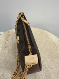 Coach Teri Shoulder Bag with gold chain and zipper detail.