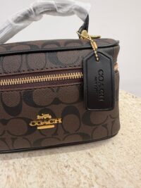 Coach Vanity Case with logo, elegant and practical design.