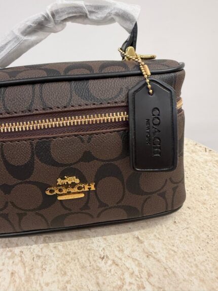 Coach Vanity Case with logo, elegant and practical design.