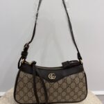 Gucci Aphrodite GG leather shoulder bag on display.