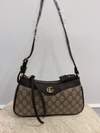 Gucci Aphrodite GG leather shoulder bag on display.