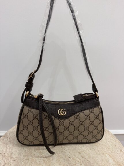 Gucci Aphrodite GG leather shoulder bag on display.