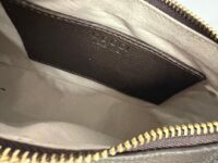 Gucci Aphrodite GG handbag interior with gold zipper detail.