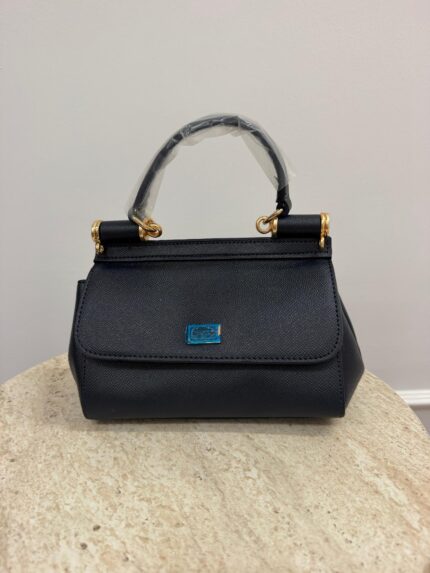 Dolce & Gabbana Sicily Mini handbag on marble surface.