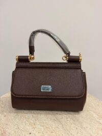 Dolce & Gabbana Sicily Mini brown handbag with gold accents.