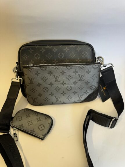 Black Louis Vuitton Trio Messenger with monogram design.