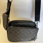 Black Louis Vuitton Trio Messenger with monogram design.