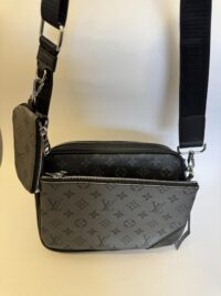 Black Louis Vuitton Trio Messenger with monogram design.
