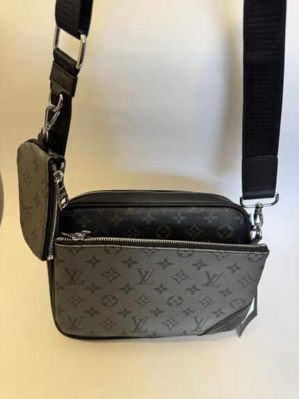 Black Louis Vuitton Trio Messenger with monogram design.